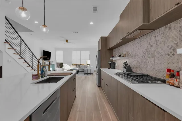 a view of kitchen with cabinets and wooden floor
