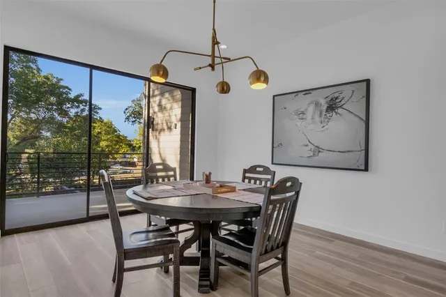 a kitchen with sink stove and cabinets