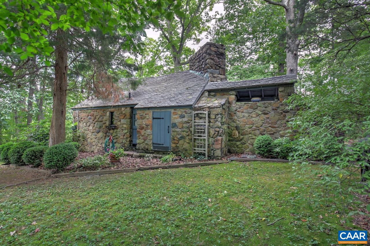 5492 Louisa Road Keswick, VA 22947 - Photo 1 of 3 a view of a house with garden and trees