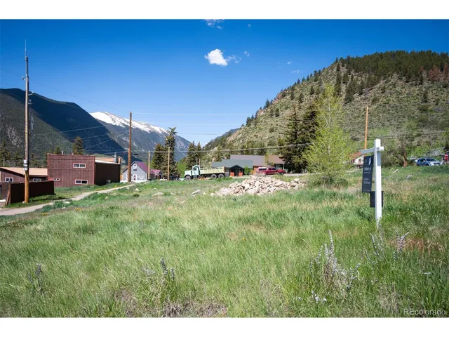 a view of a field with an trees