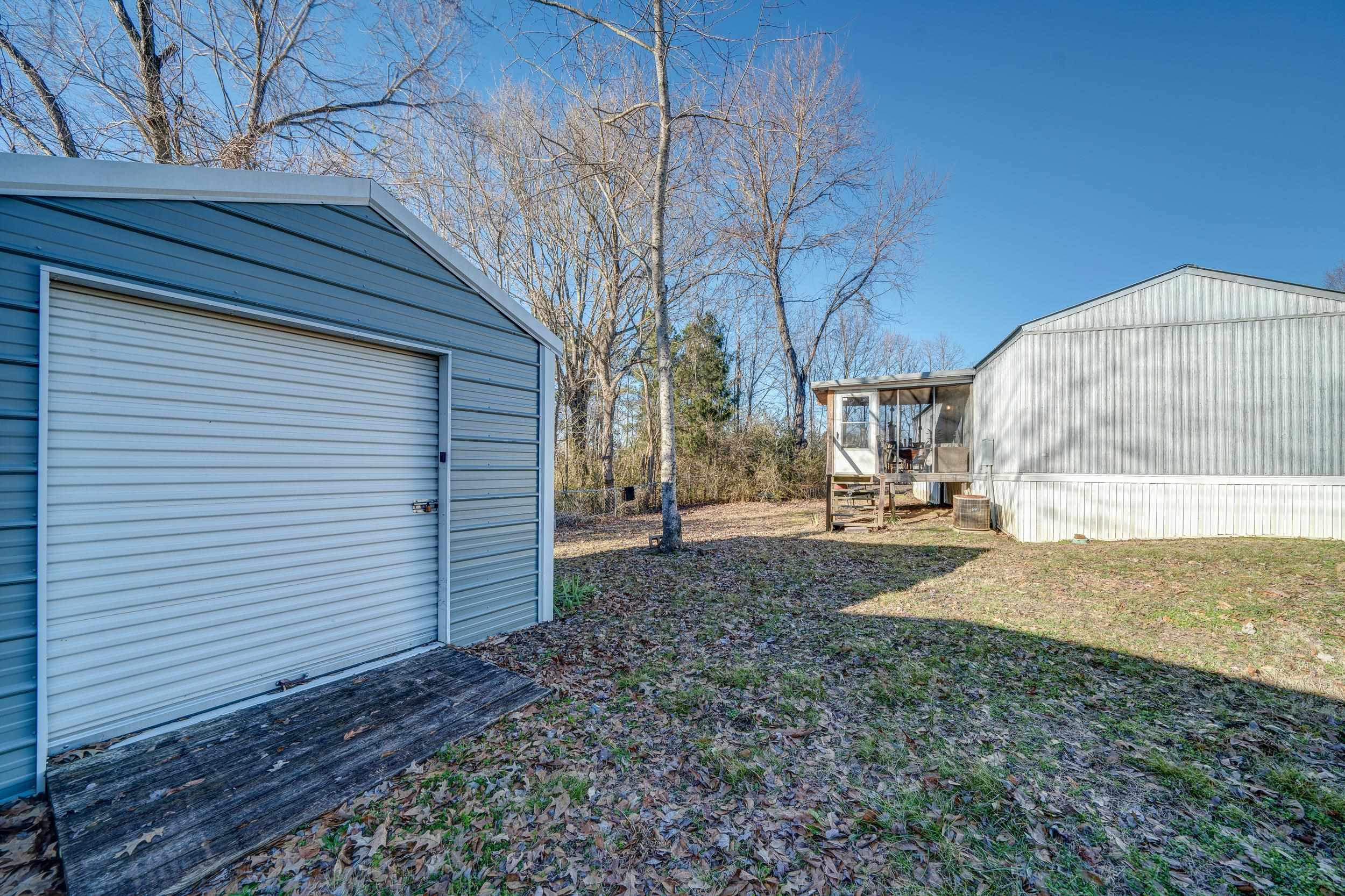 24315 Highway 76 Somerville, TN 38068 - Photo 16 of 27 a view of a backyard with large trees