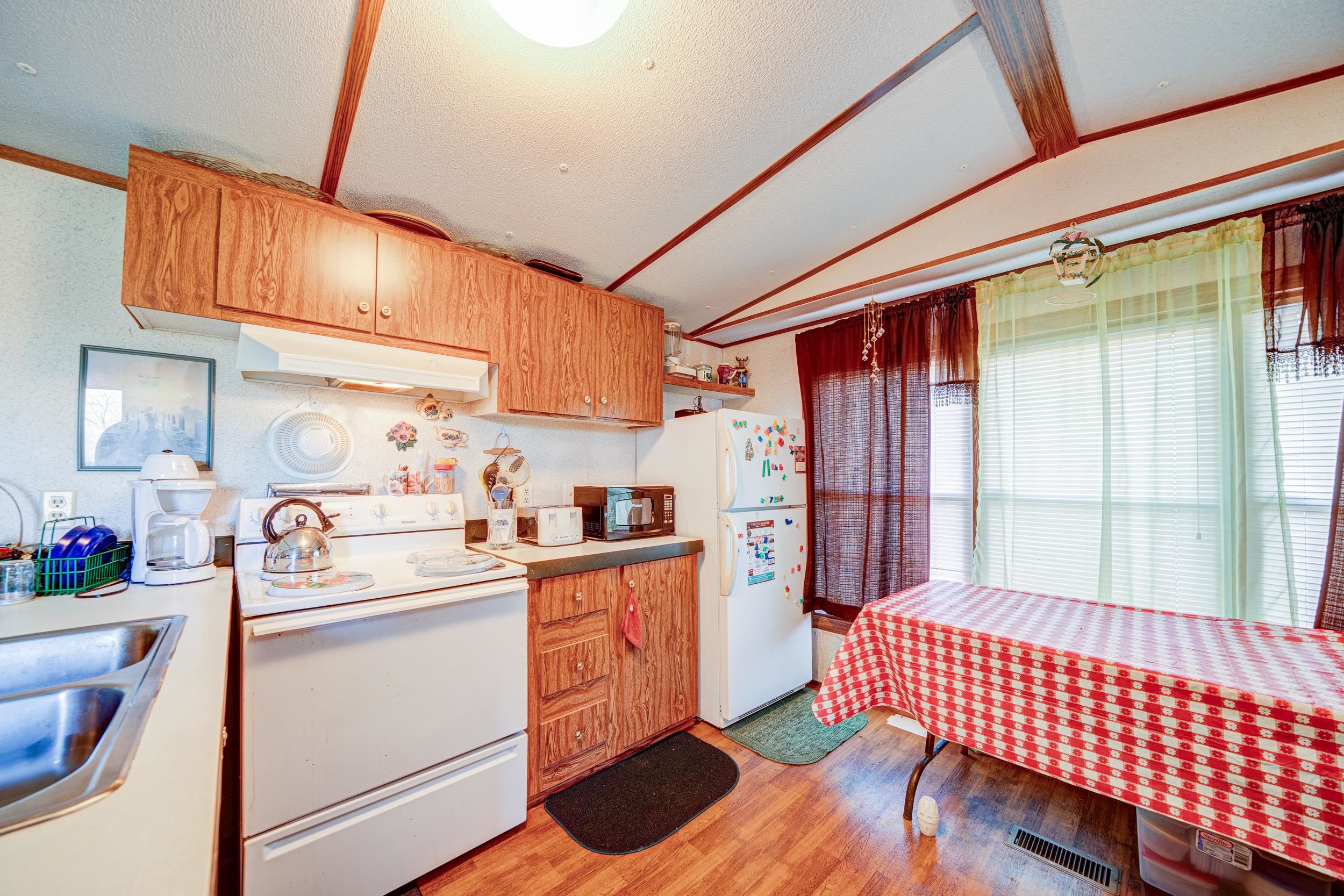 24315 Highway 76 Somerville, TN 38068 - Photo 21 of 27 a kitchen that has a sink and cabinets