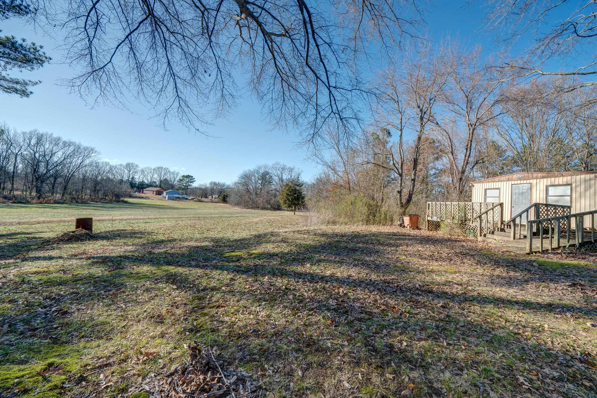 24315 Highway 76 Somerville, TN 38068 - Photo 26 of 27 a view of a yard with an outdoor space