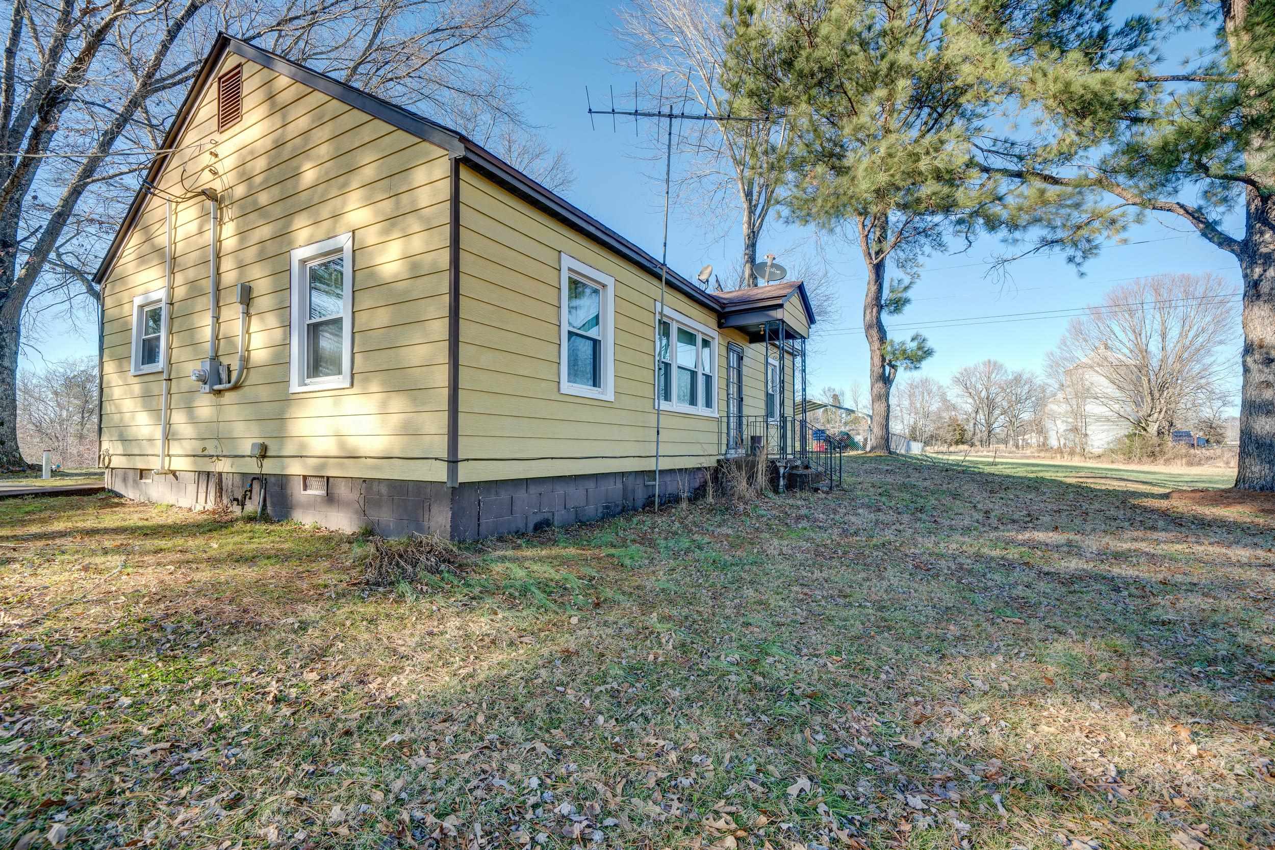 24315 Highway 76 Somerville, TN 38068 - Photo 3 of 27 a view of a house with a yard