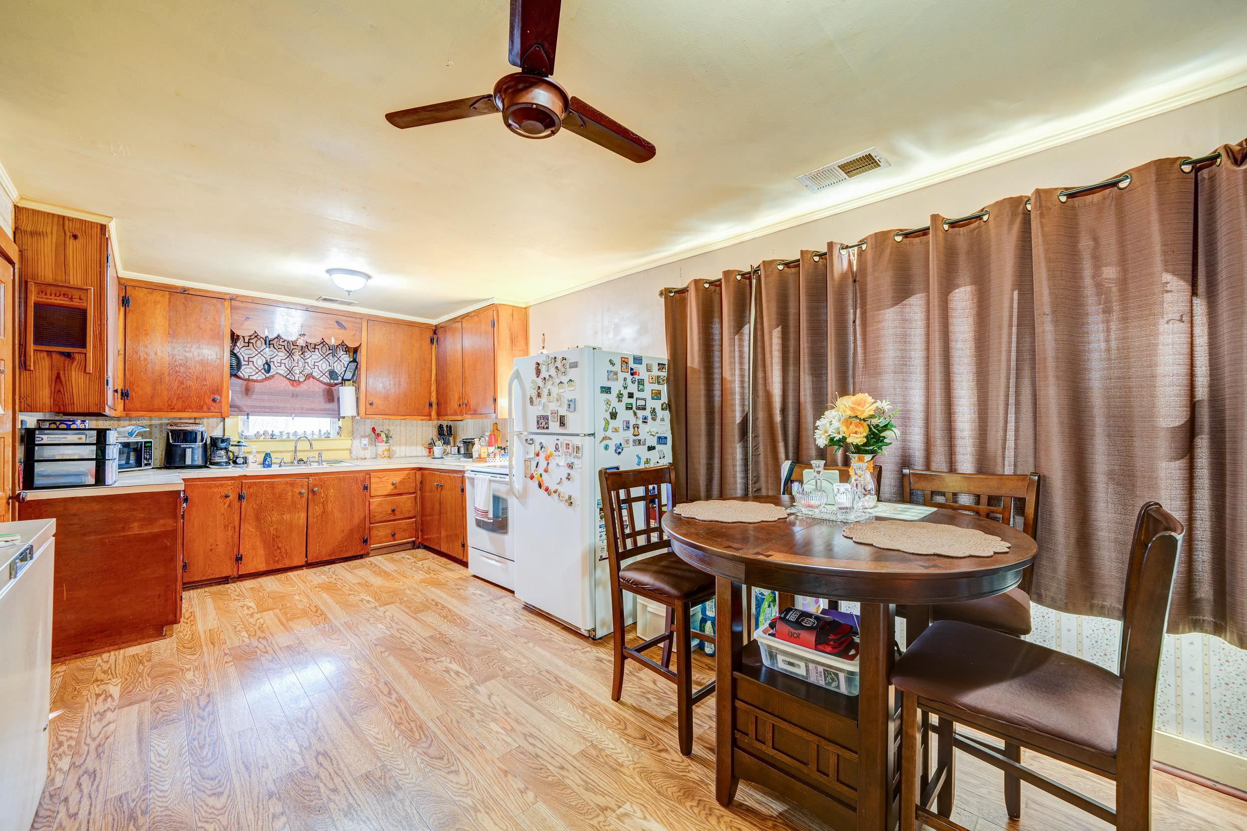 24315 Highway 76 Somerville, TN 38068 - Photo 5 of 27 a kitchen with a table chairs and a dining table