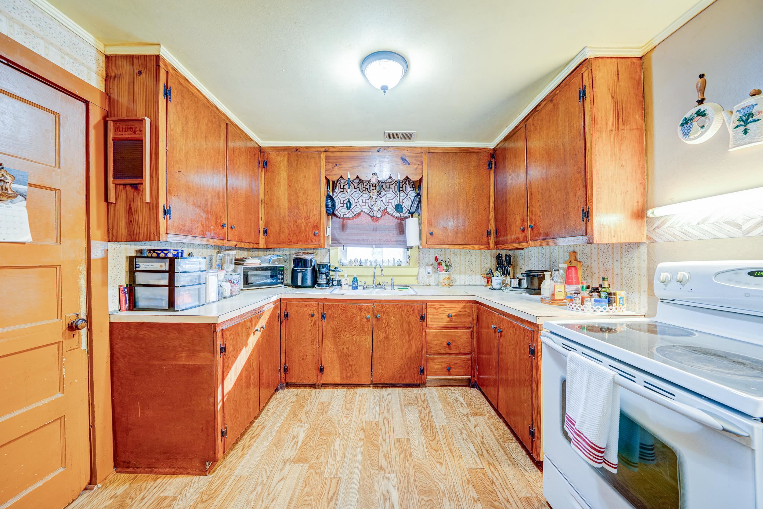 24315 Highway 76 Somerville, TN 38068 - Photo 6 of 27 a view of a kitchen with a sink and cabinets
