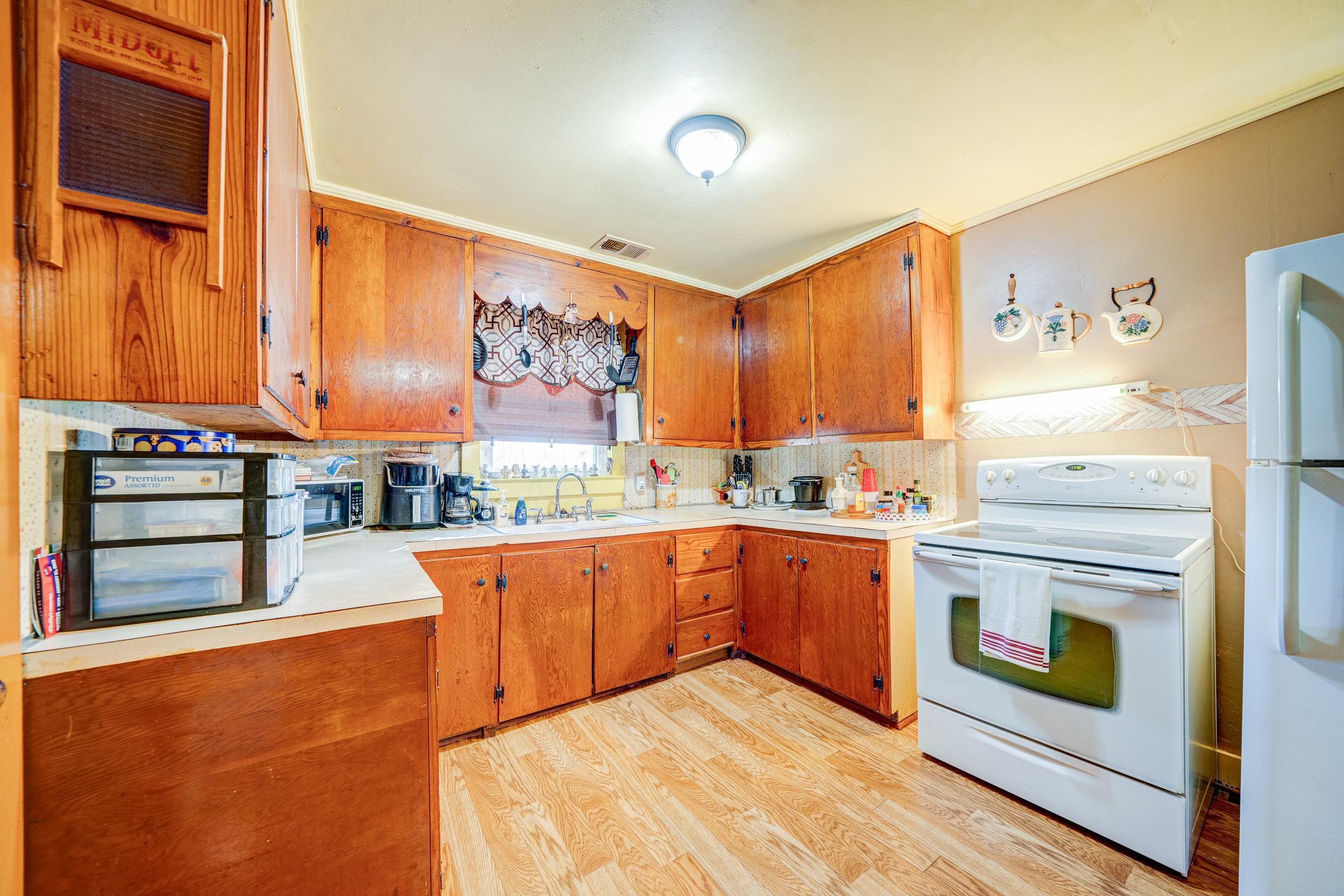 24315 Highway 76 Somerville, TN 38068 - Photo 7 of 27 a kitchen with stainless steel appliances granite countertop a stove and a refrigerator
