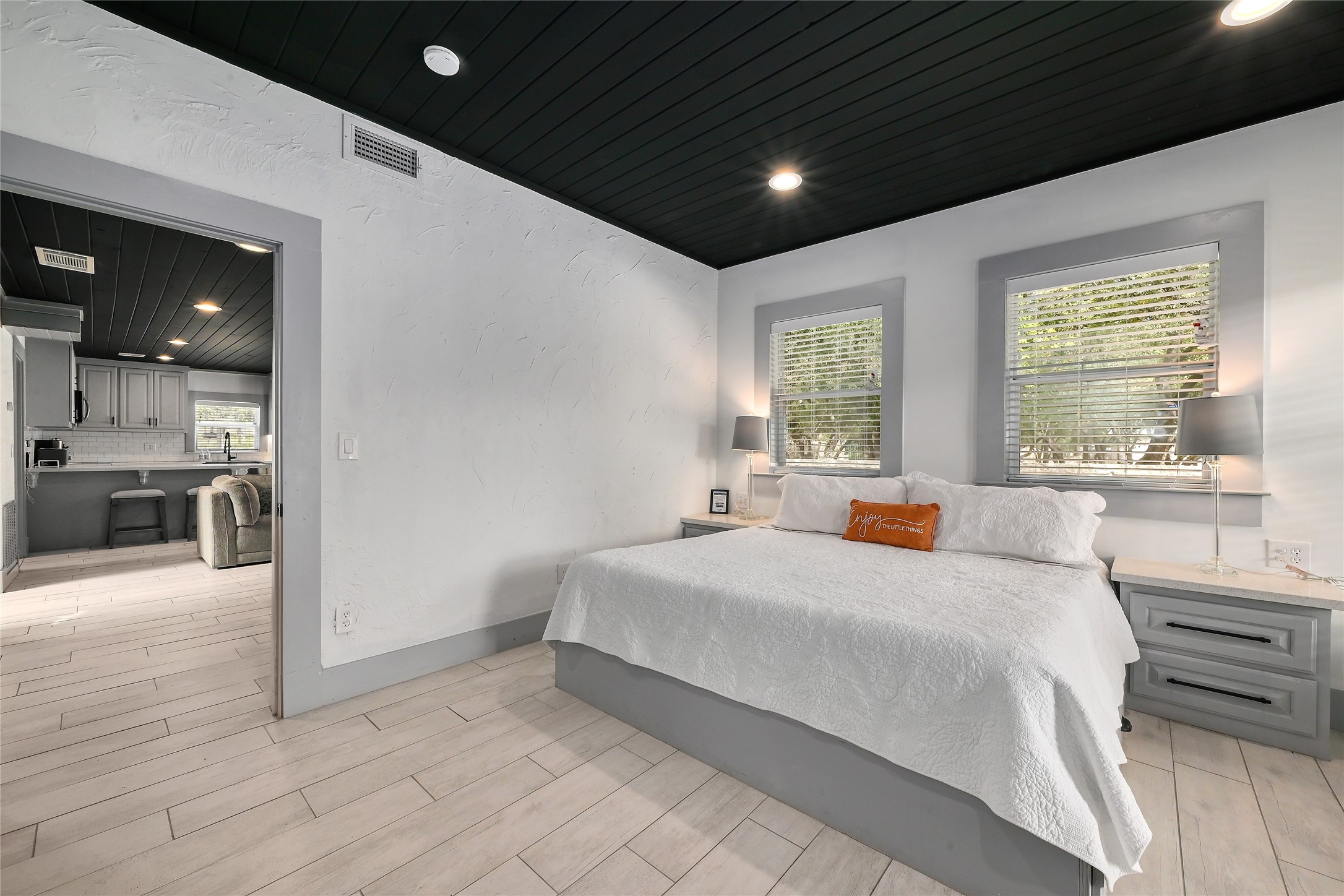 2903 Oak Ridge Drive Spicewood, TX 78669 - Photo 7 of 33 Main House Downstairs Bedroom featuring wood ceiling, wood tiled floors and recessed lighting