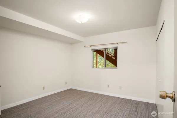 a bathroom with a bathtub and a window