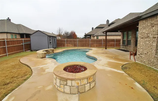 a backyard of house with outdoor seating