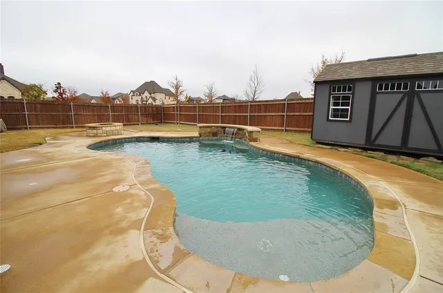 a view of a swimming pool with an ocean view