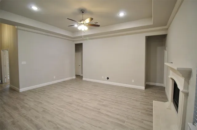 a view of an empty room with a fireplace