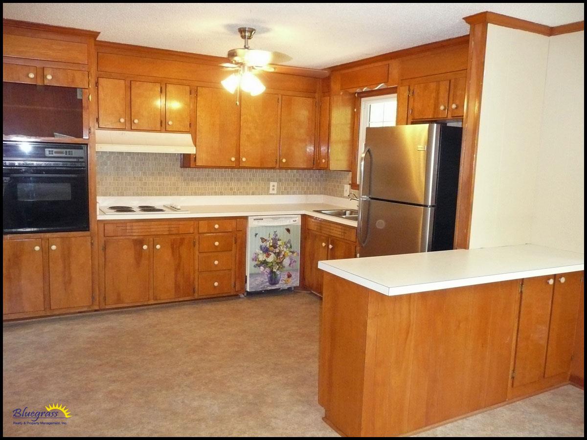 464 Rural Hill Road Nashville, TN 37217 - Photo 9 of 15 a kitchen with stainless steel appliances a refrigerator a sink a stove a microwave a counter top and cabinets