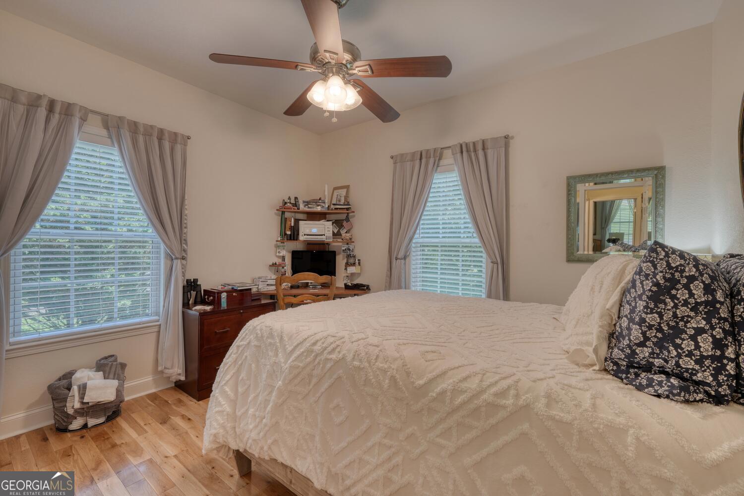 273 Coosa Valley Road Blairsville, GA 30512 - Photo 23 of 34 a bedroom with a bed and wooden floor