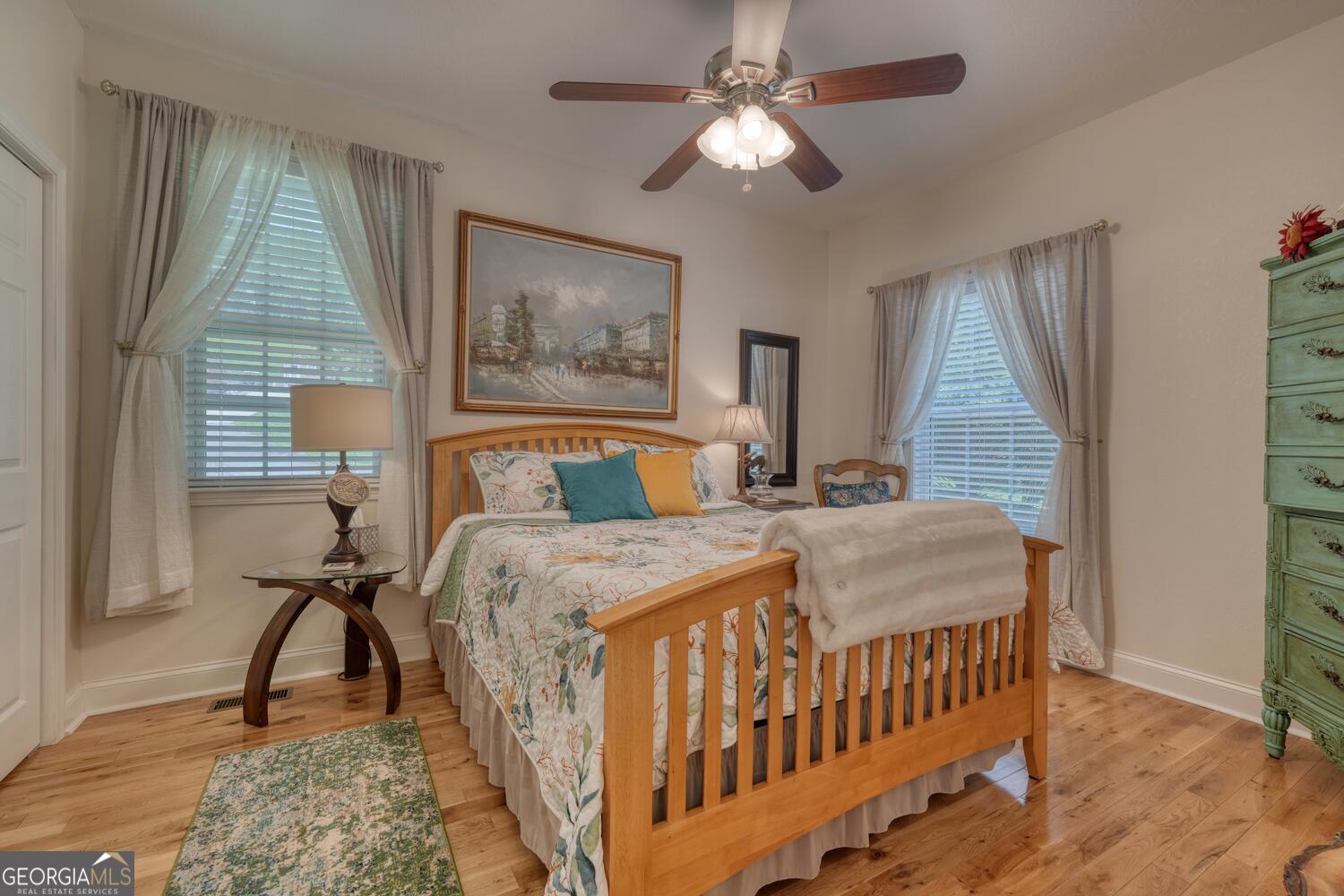 273 Coosa Valley Road Blairsville, GA 30512 - Photo 25 of 34 a bedroom with a bed and a chandelier