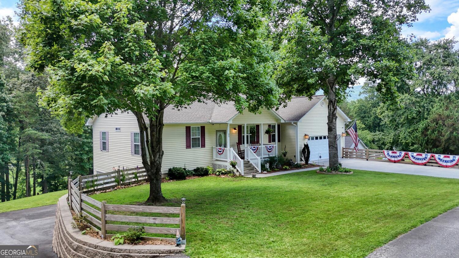 273 Coosa Valley Road Blairsville, GA 30512 - Photo 7 of 34 a front view of a house with garden