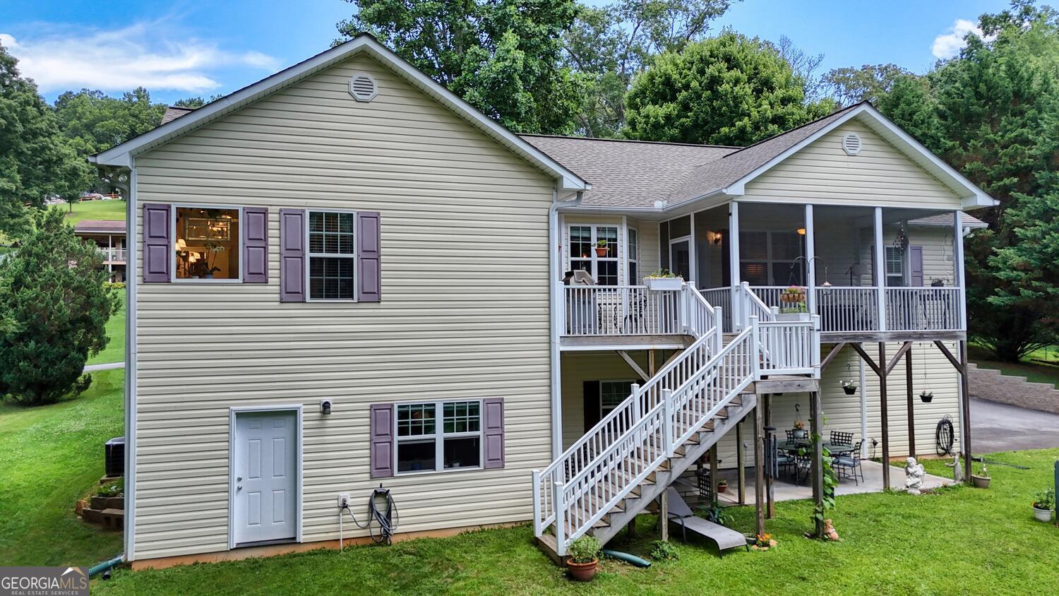 273 Coosa Valley Road Blairsville, GA 30512 - Photo 8 of 34 a view of a house with a yard