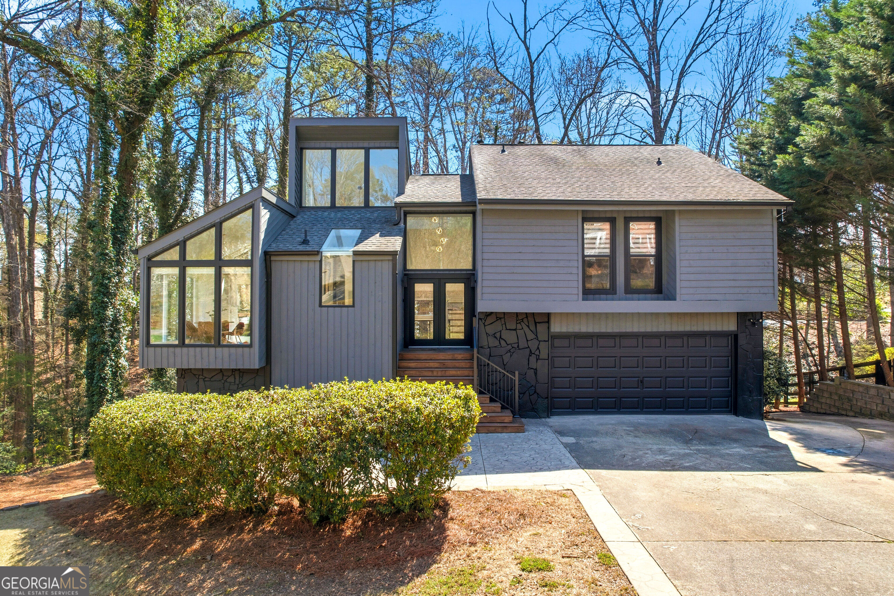 2704 Long Lake Drive Northeast Roswell, GA 30075 - Photo 1 of 1 a front view of a house with garden