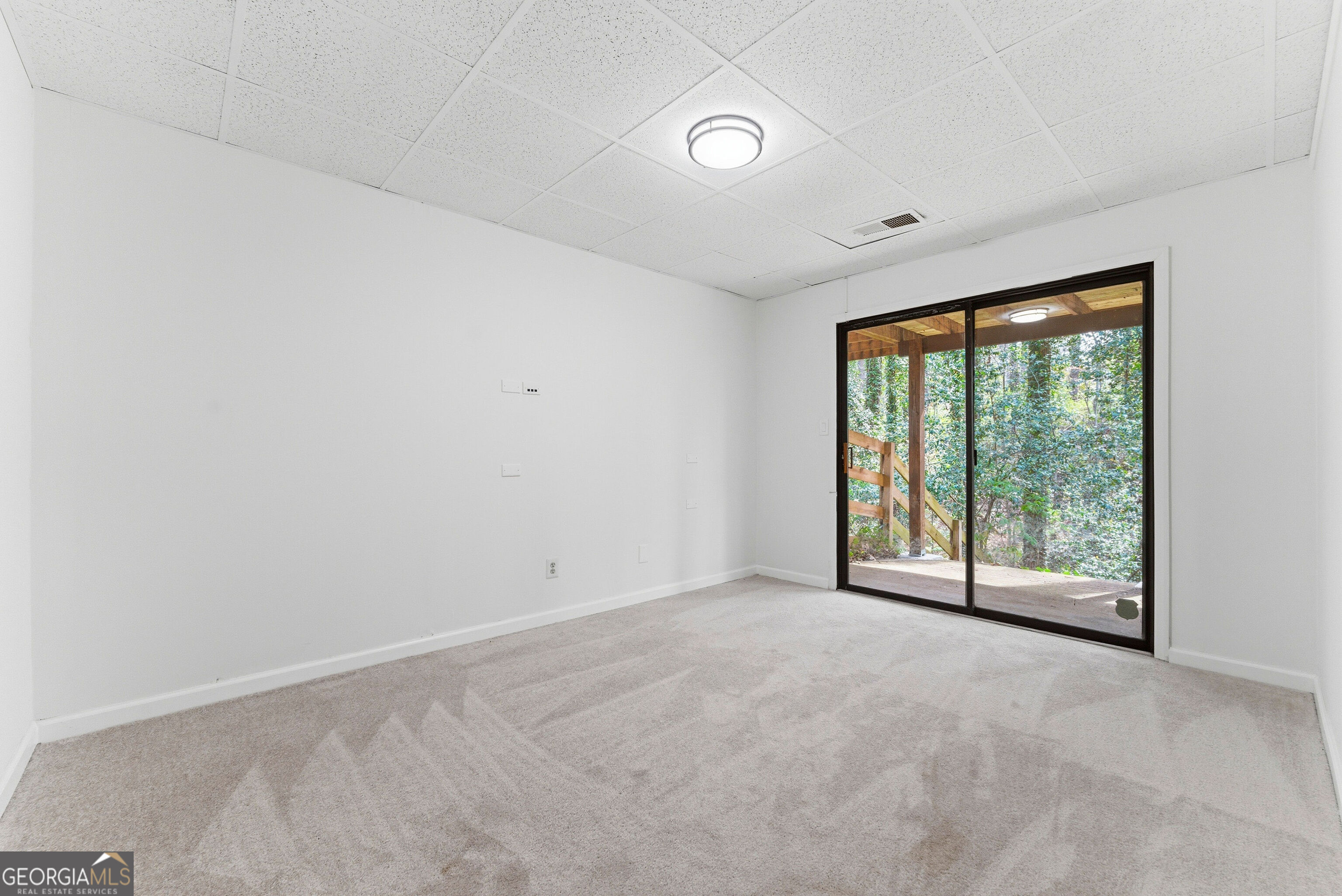2704 Long Lake Drive Northeast Roswell, GA 30075 - Photo 13 of 48 a view of an empty room with a window