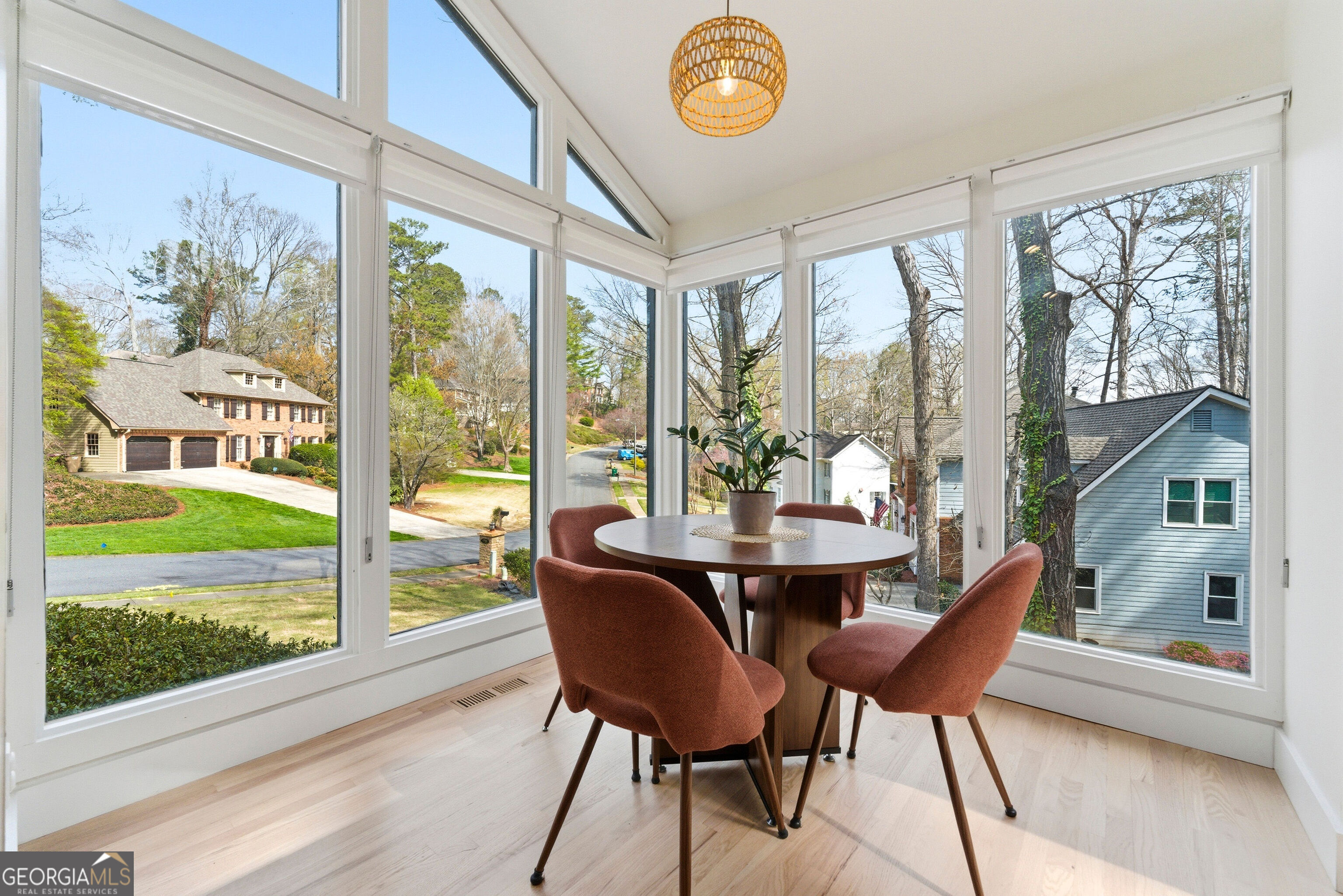 2704 Long Lake Drive Northeast Roswell, GA 30075 - Photo 16 of 48 a view of a dining room with furniture large windows and wooden floor