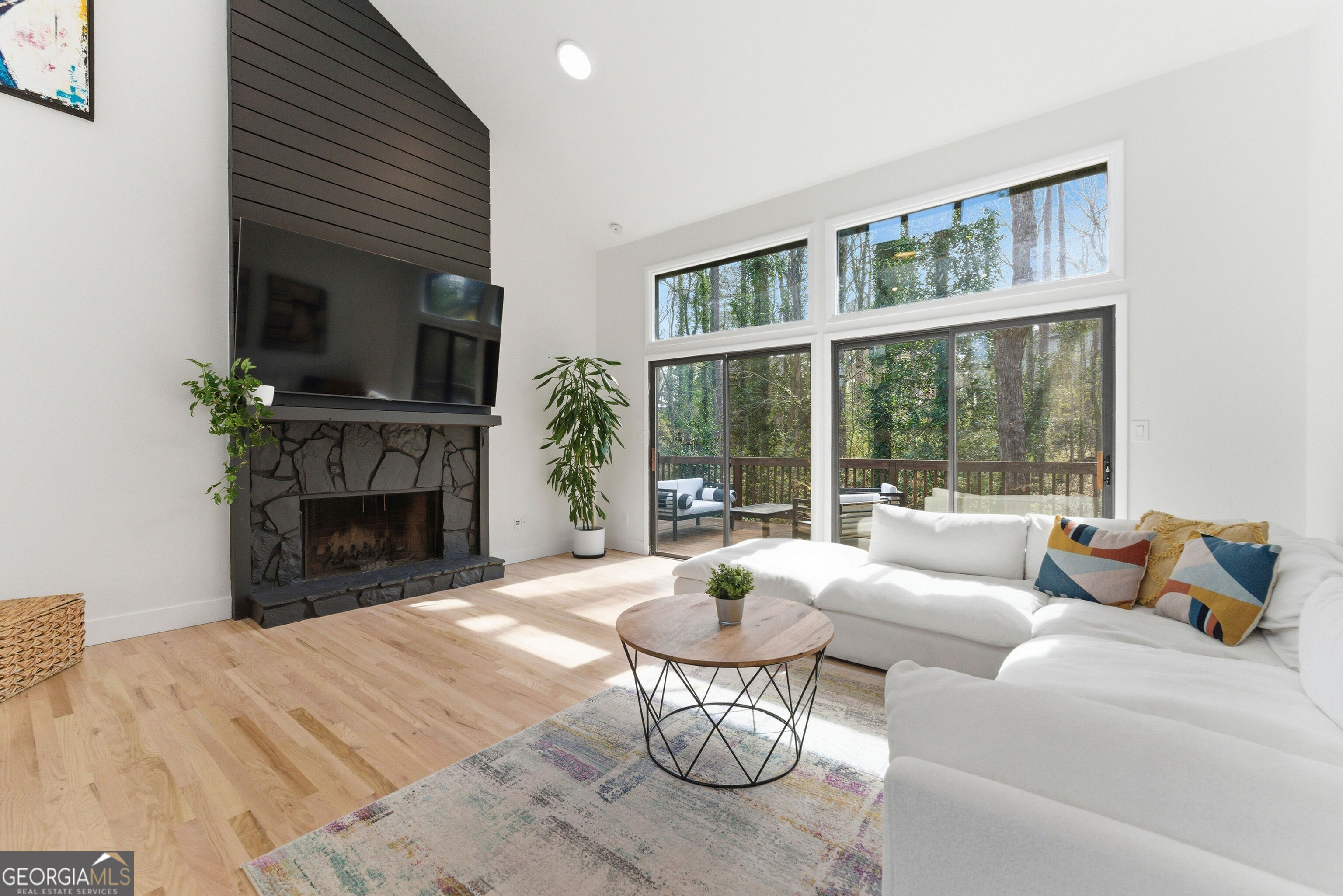 2704 Long Lake Drive Northeast Roswell, GA 30075 - Photo 18 of 48 a living room with furniture and a fireplace