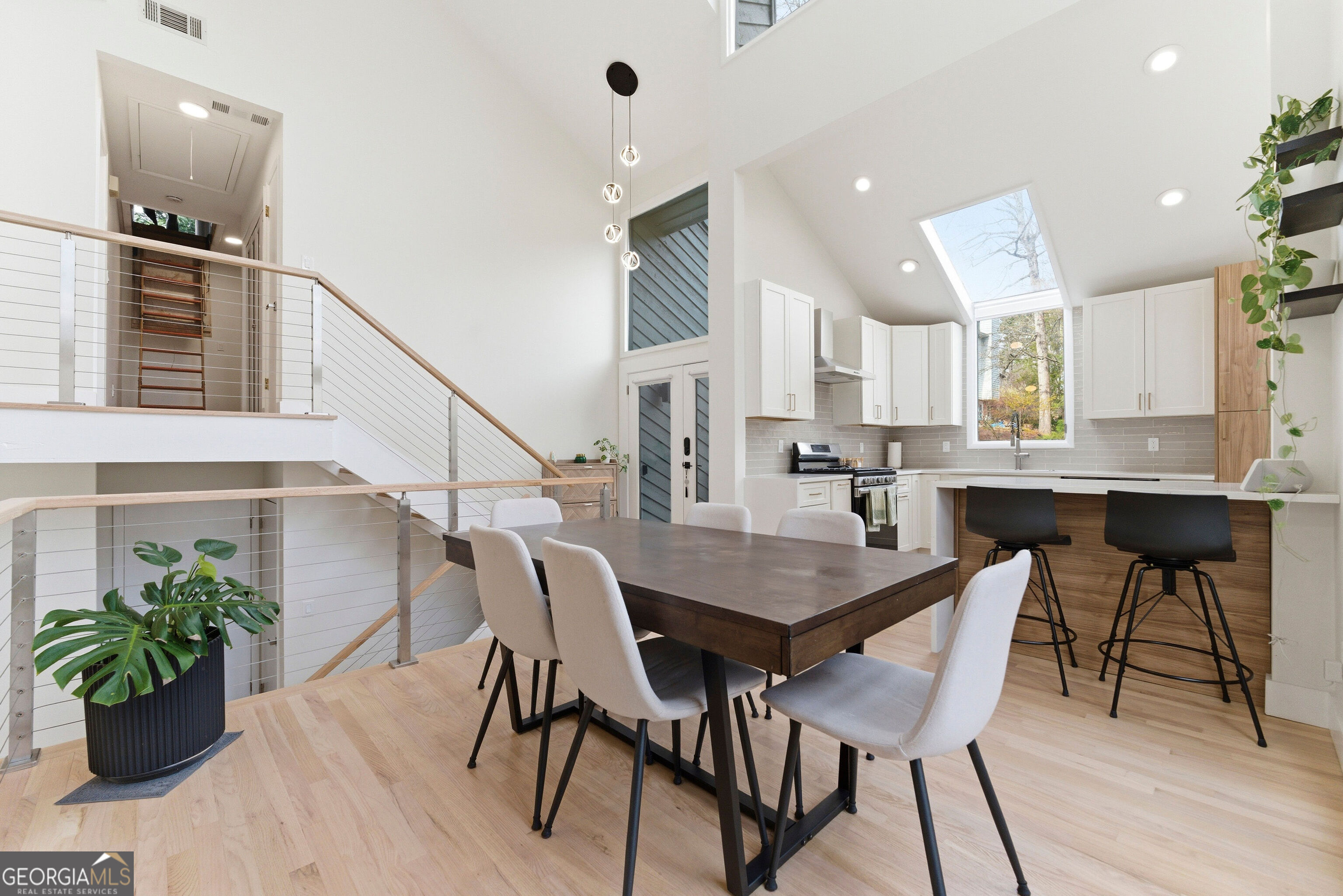 2704 Long Lake Drive Northeast Roswell, GA 30075 - Photo 21 of 48 a view of a dining room with furniture and wooden floor