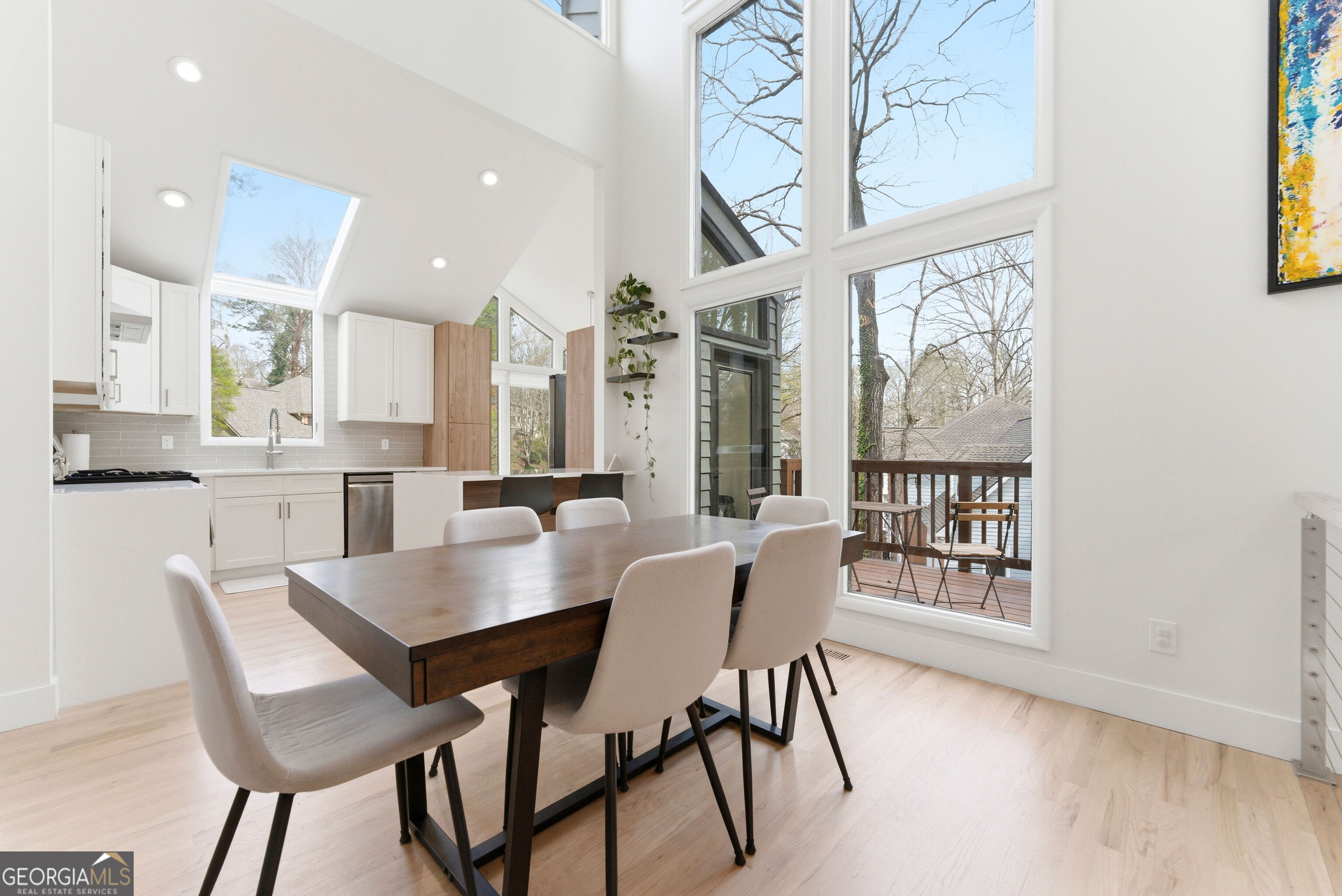 2704 Long Lake Drive Northeast Roswell, GA 30075 - Photo 23 of 48 a view of a dining room with furniture and a large window