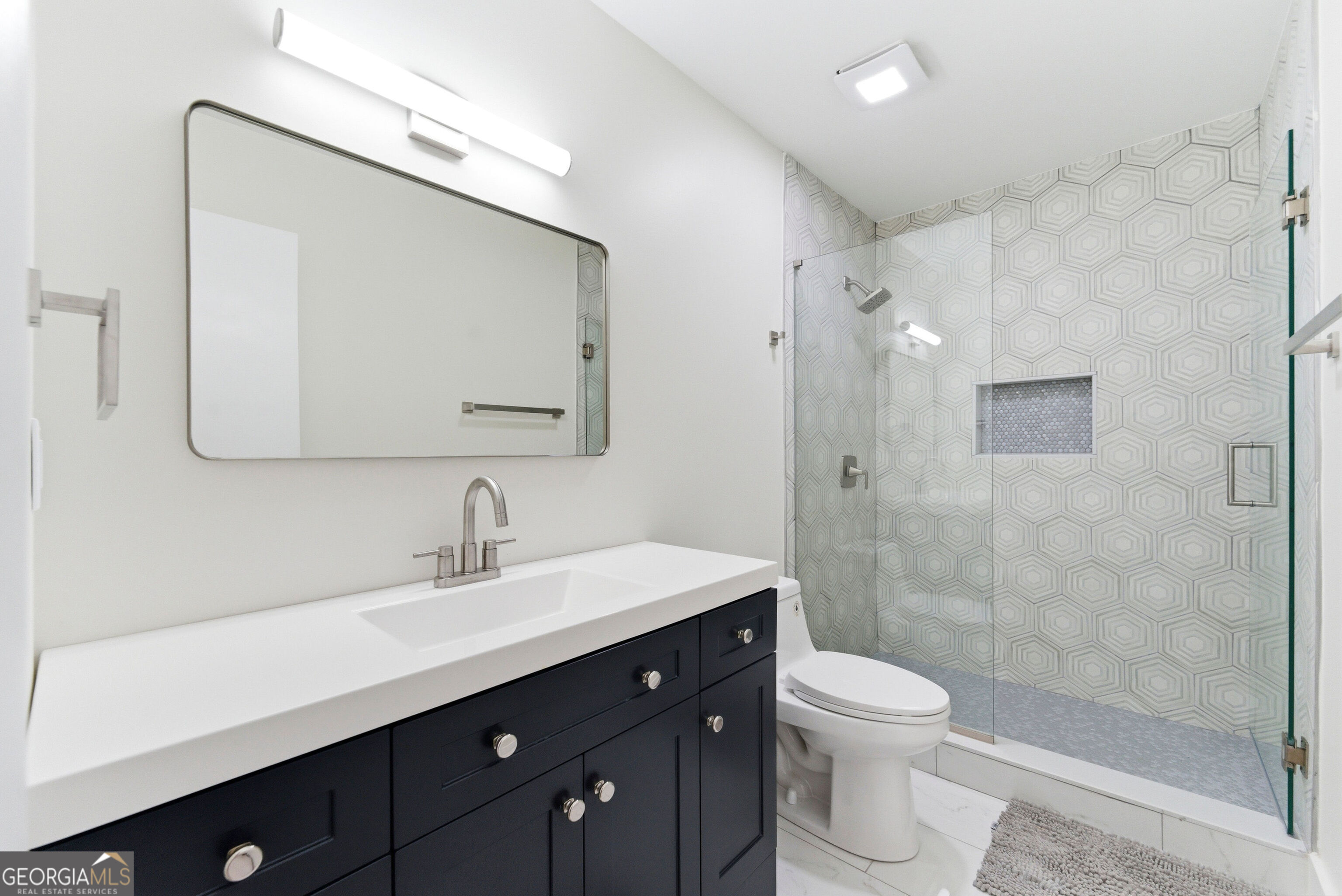 2704 Long Lake Drive Northeast Roswell, GA 30075 - Photo 24 of 48 a bathroom with a double vanity sink toilet and shower