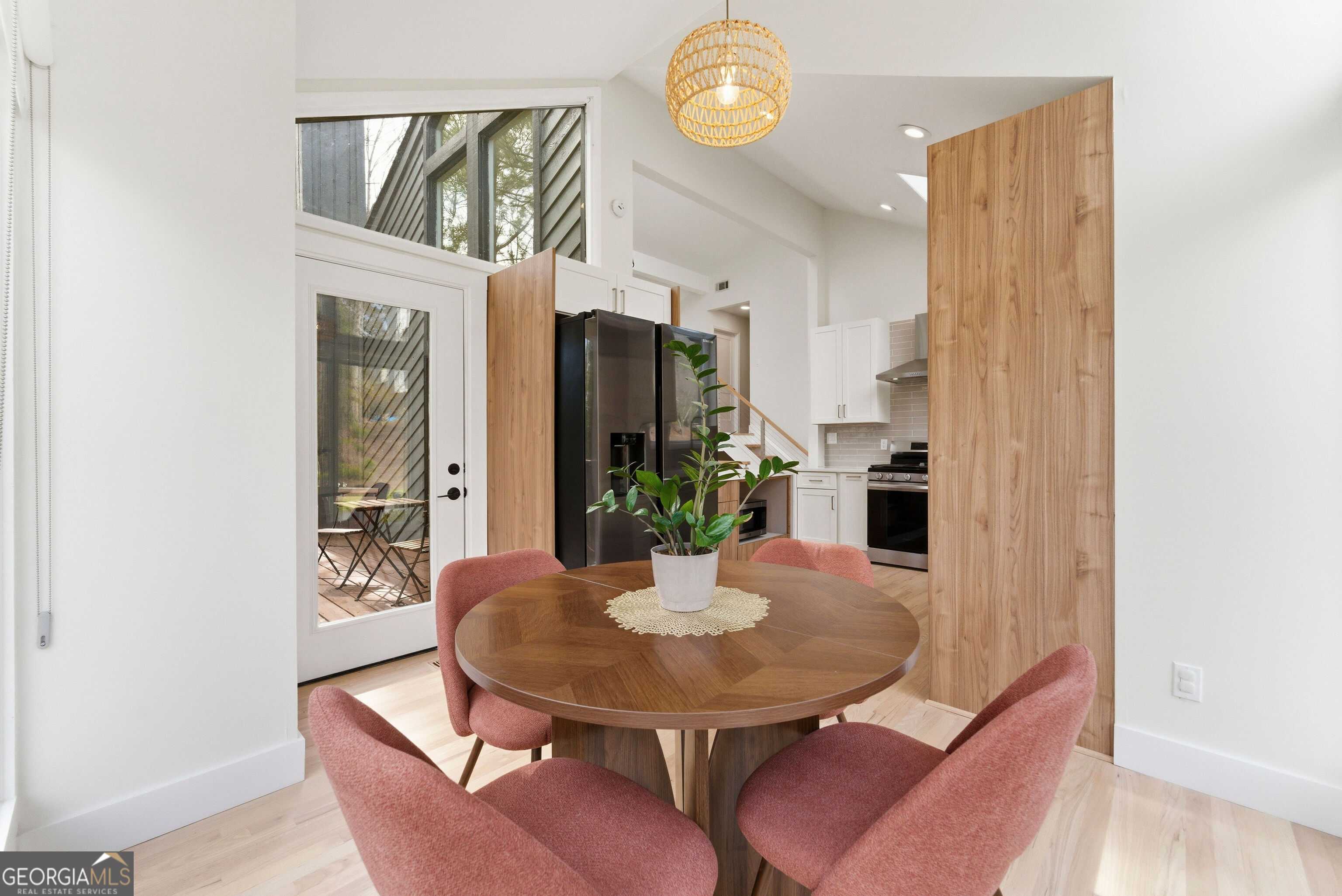 2704 Long Lake Drive Northeast Roswell, GA 30075 - Photo 34 of 48 a view of a dining room with furniture and wooden floor