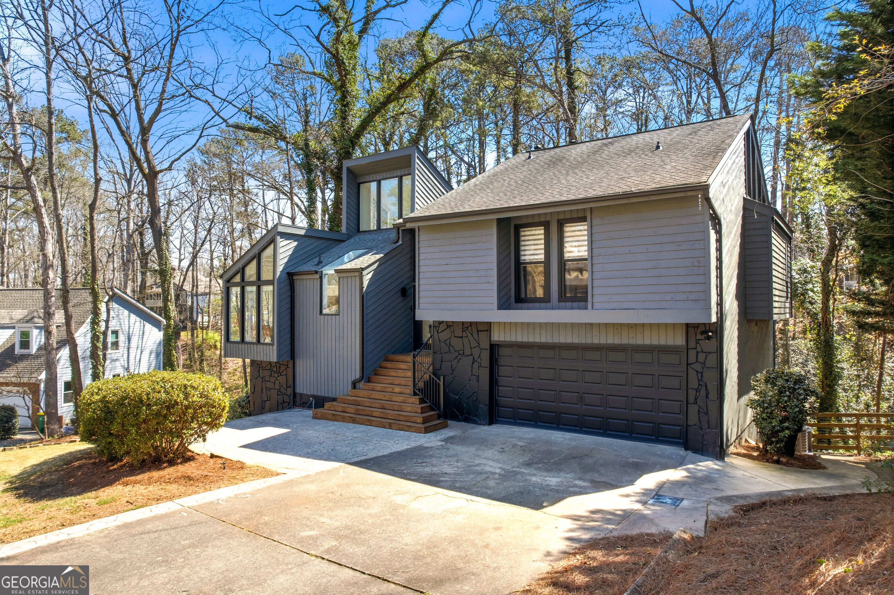 2704 Long Lake Drive Northeast Roswell, GA 30075 - Photo 36 of 48 a front view of a house with a yard
