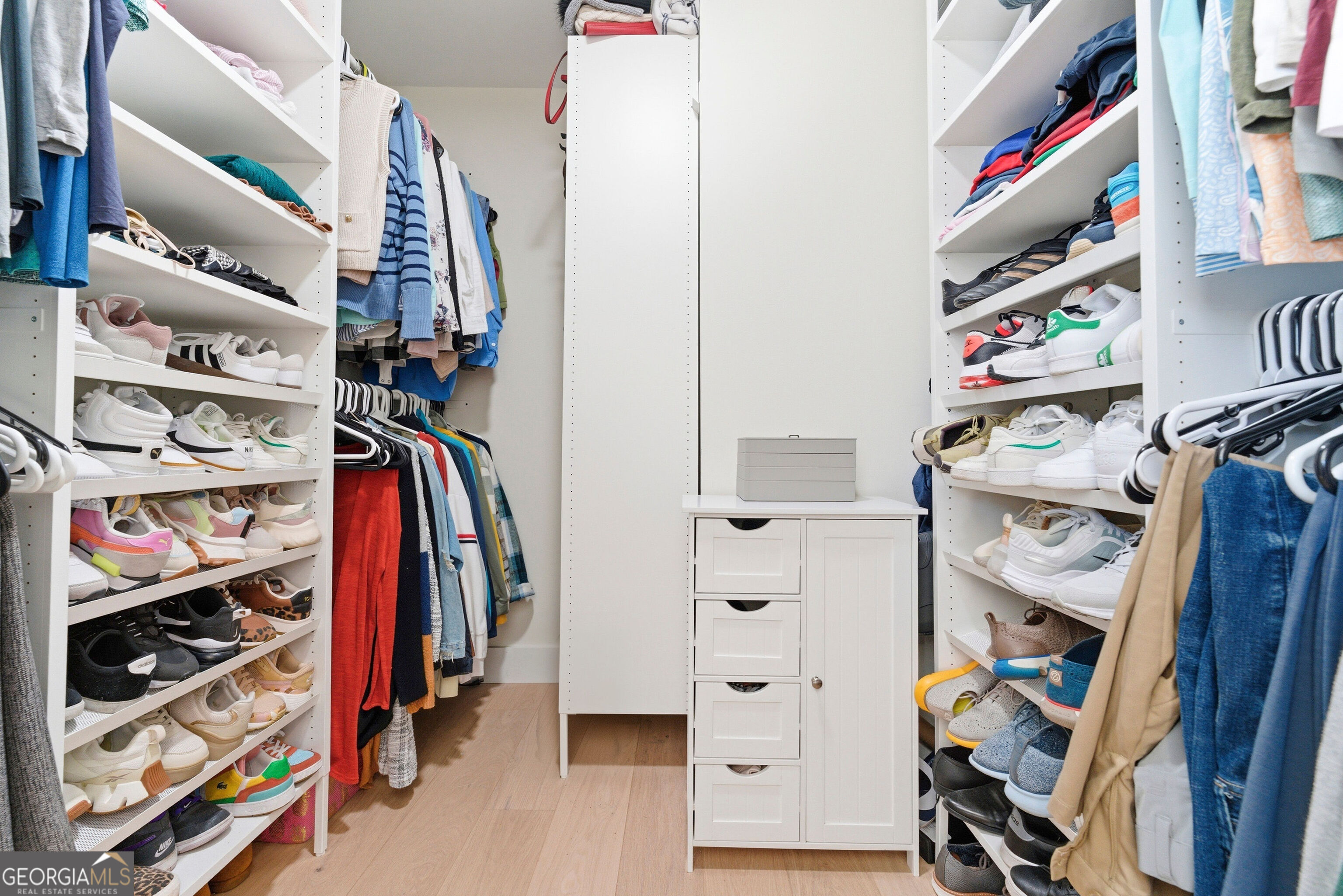 2704 Long Lake Drive Northeast Roswell, GA 30075 - Photo 41 of 48 a view of walk in closet with clothes and shoes