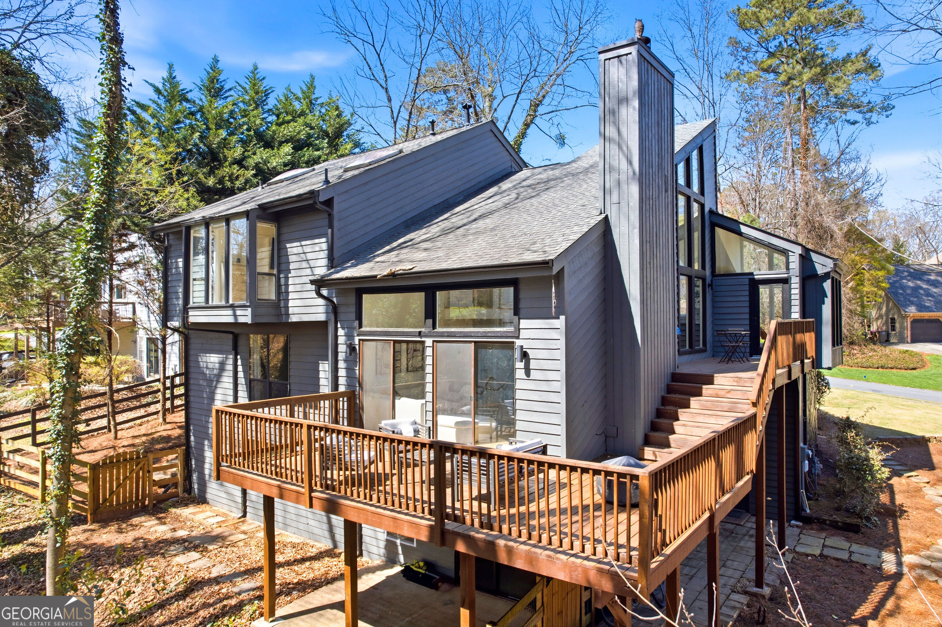2704 Long Lake Drive Northeast Roswell, GA 30075 - Photo 44 of 48 a view of a house with a deck and furniture