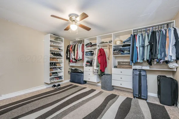 a bedroom with a bed and a walk in closet