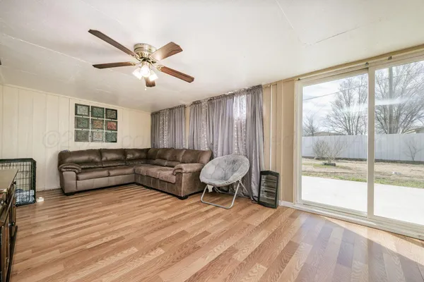 a living room with furniture and a large window