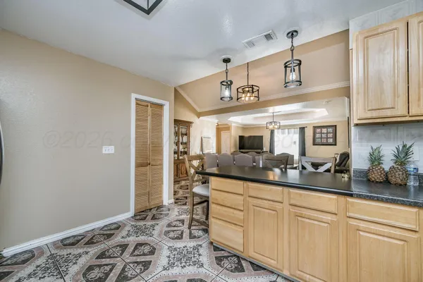 a kitchen with sink and cabinets