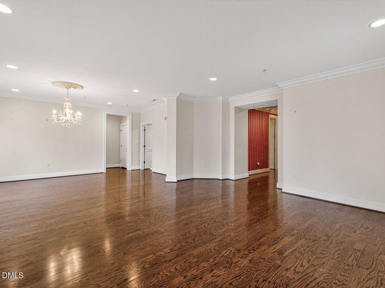 2901 Market Bridge Lane, Unit 104 Raleigh, NC 27608 - Photo 11 of 45 a view of an empty room with wooden floor and a window