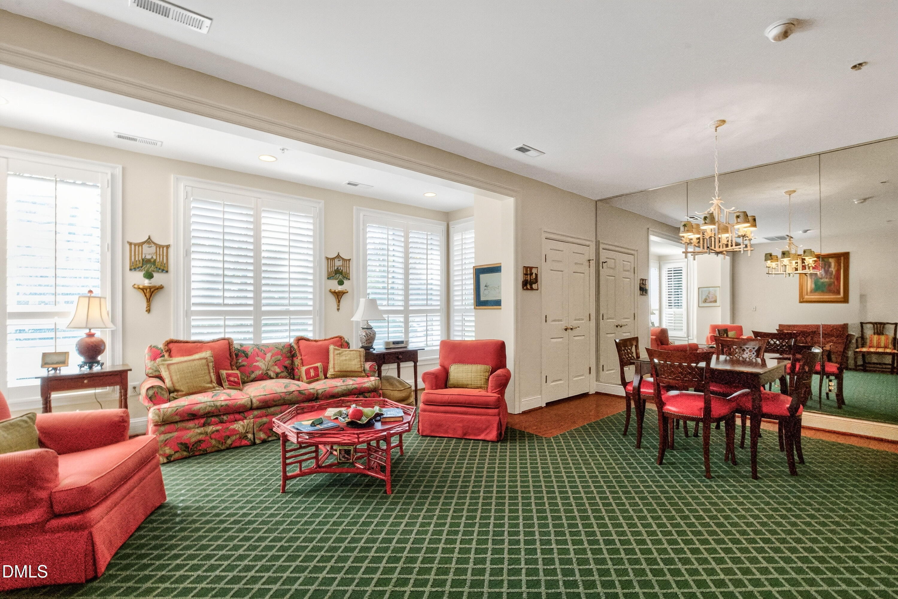 2901 Market Bridge Lane, Unit 104 Raleigh, NC 27608 - Photo 18 of 45 a living room with furniture a rug and a chandelier