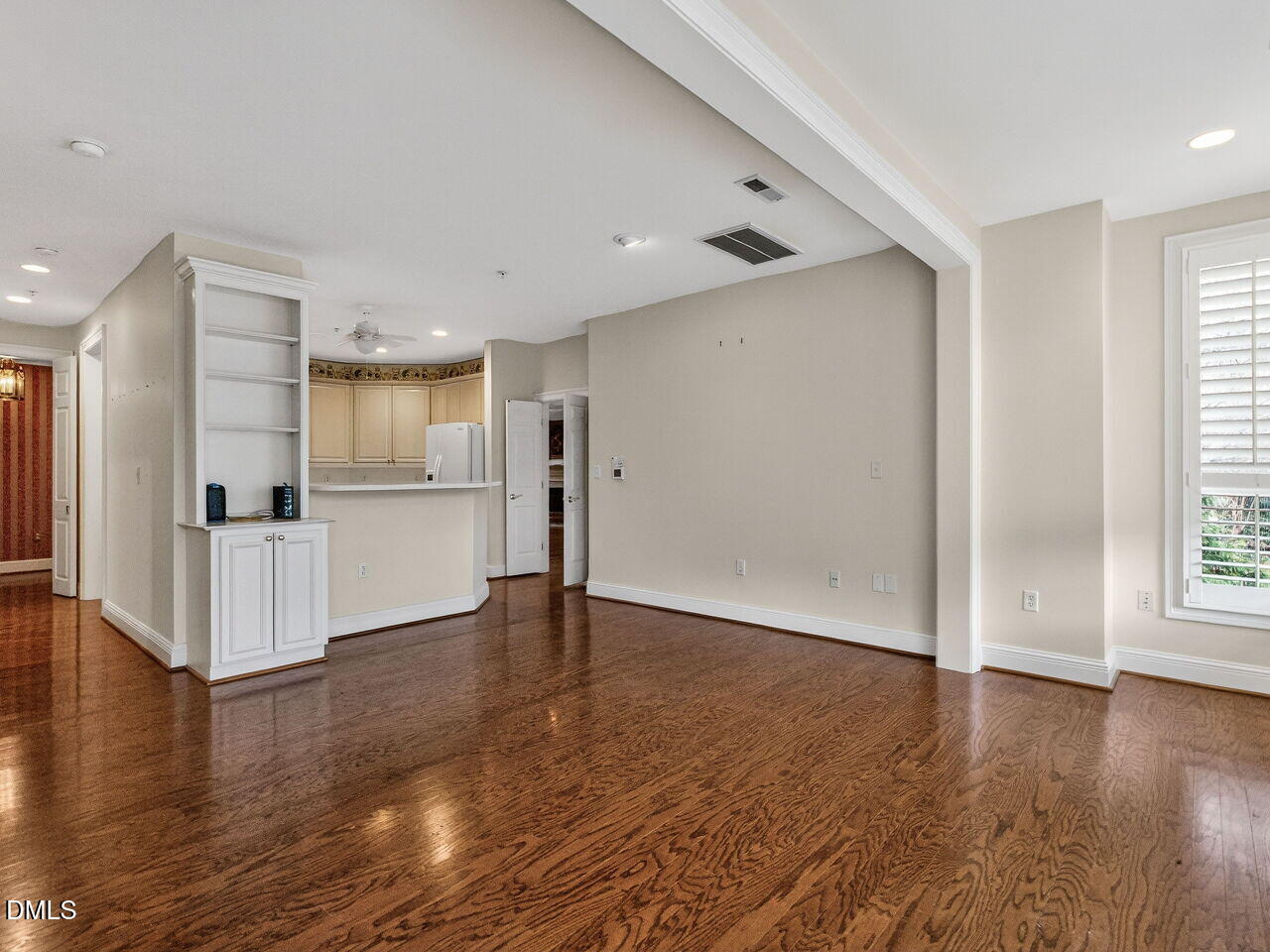 2901 Market Bridge Lane, Unit 104 Raleigh, NC 27608 - Photo 19 of 45 a view of a kitchen with a refrigerator wooden floor and a kitchen