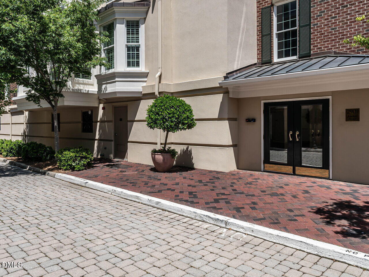 2901 Market Bridge Lane, Unit 104 Raleigh, NC 27608 - Photo 2 of 45 a house view with a outdoor space
