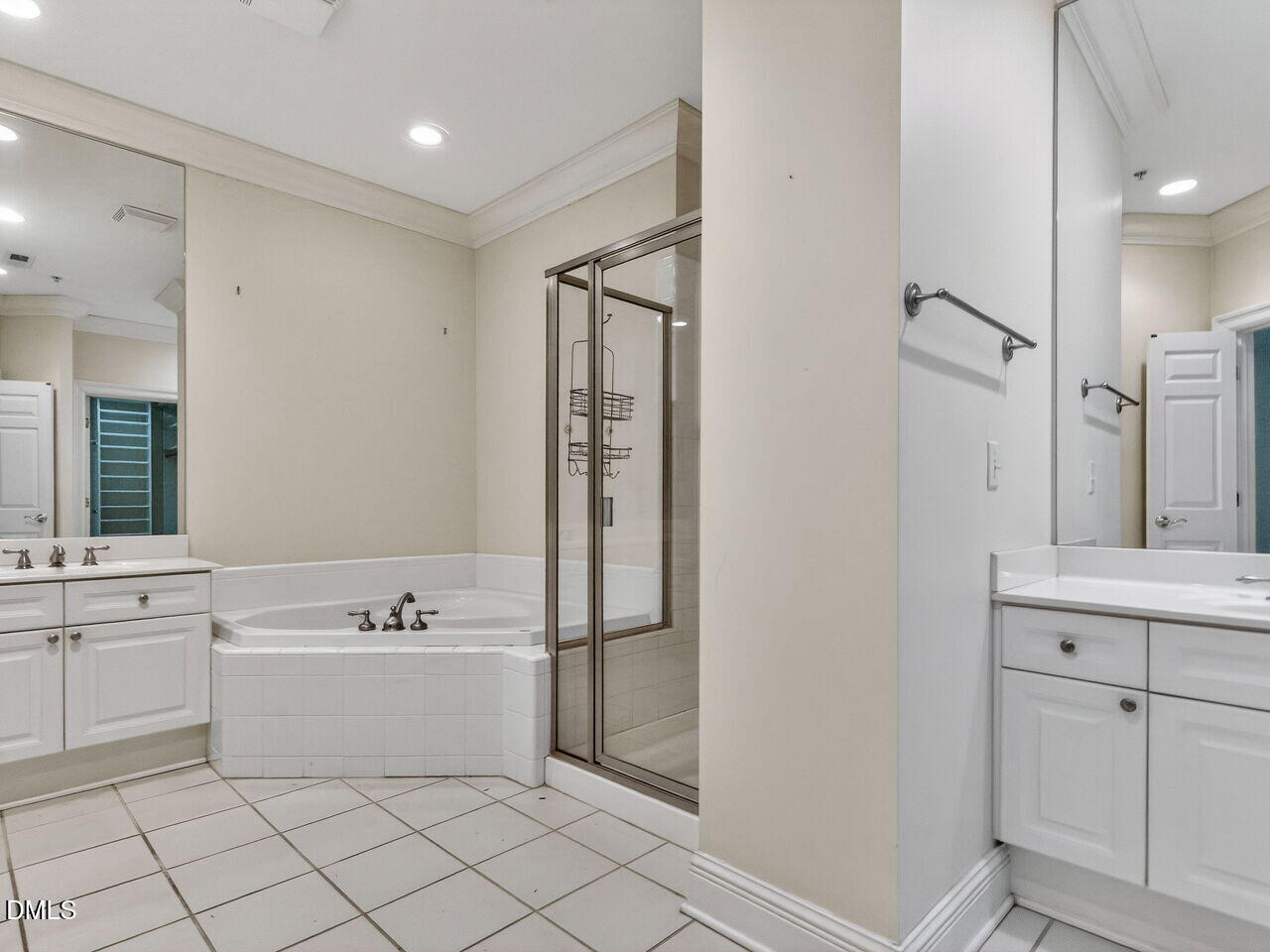 2901 Market Bridge Lane, Unit 104 Raleigh, NC 27608 - Photo 31 of 45 a bathroom with a sink vanity and mirror