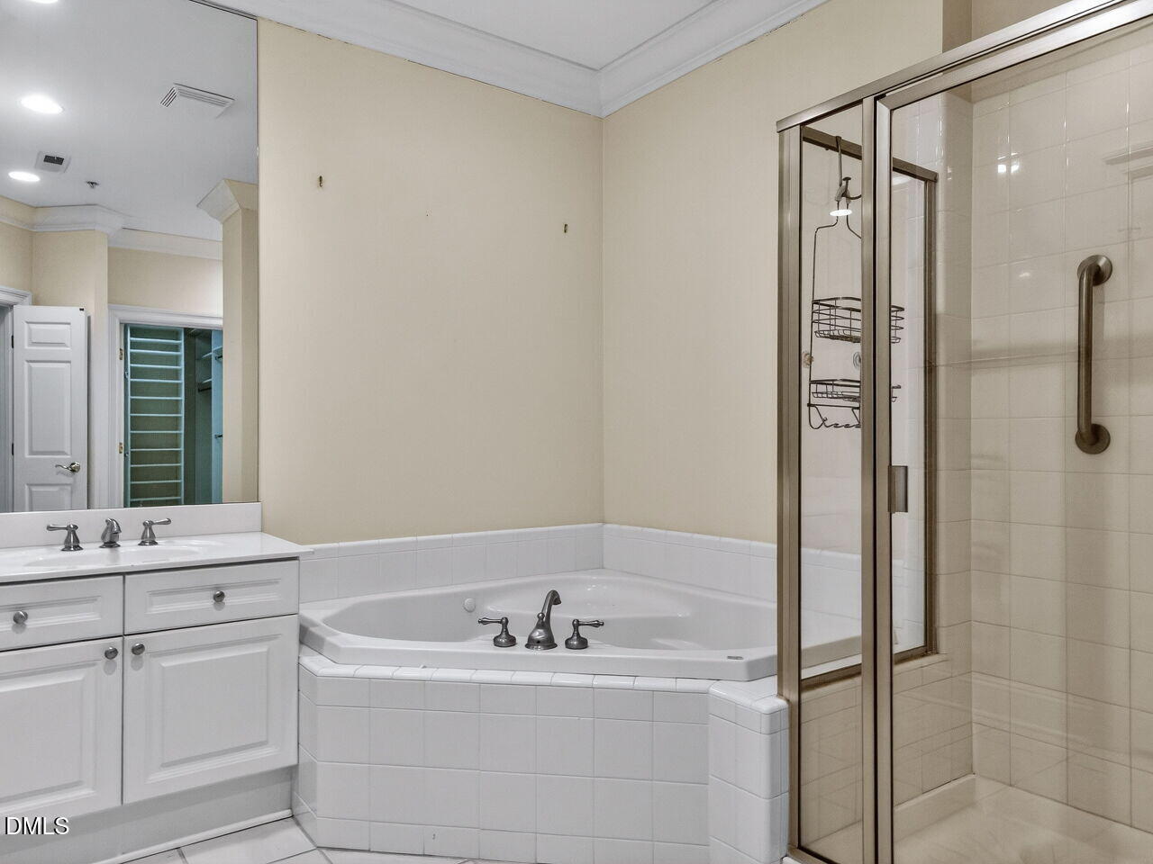 2901 Market Bridge Lane, Unit 104 Raleigh, NC 27608 - Photo 32 of 45 a bathroom with a bathtub and a sink