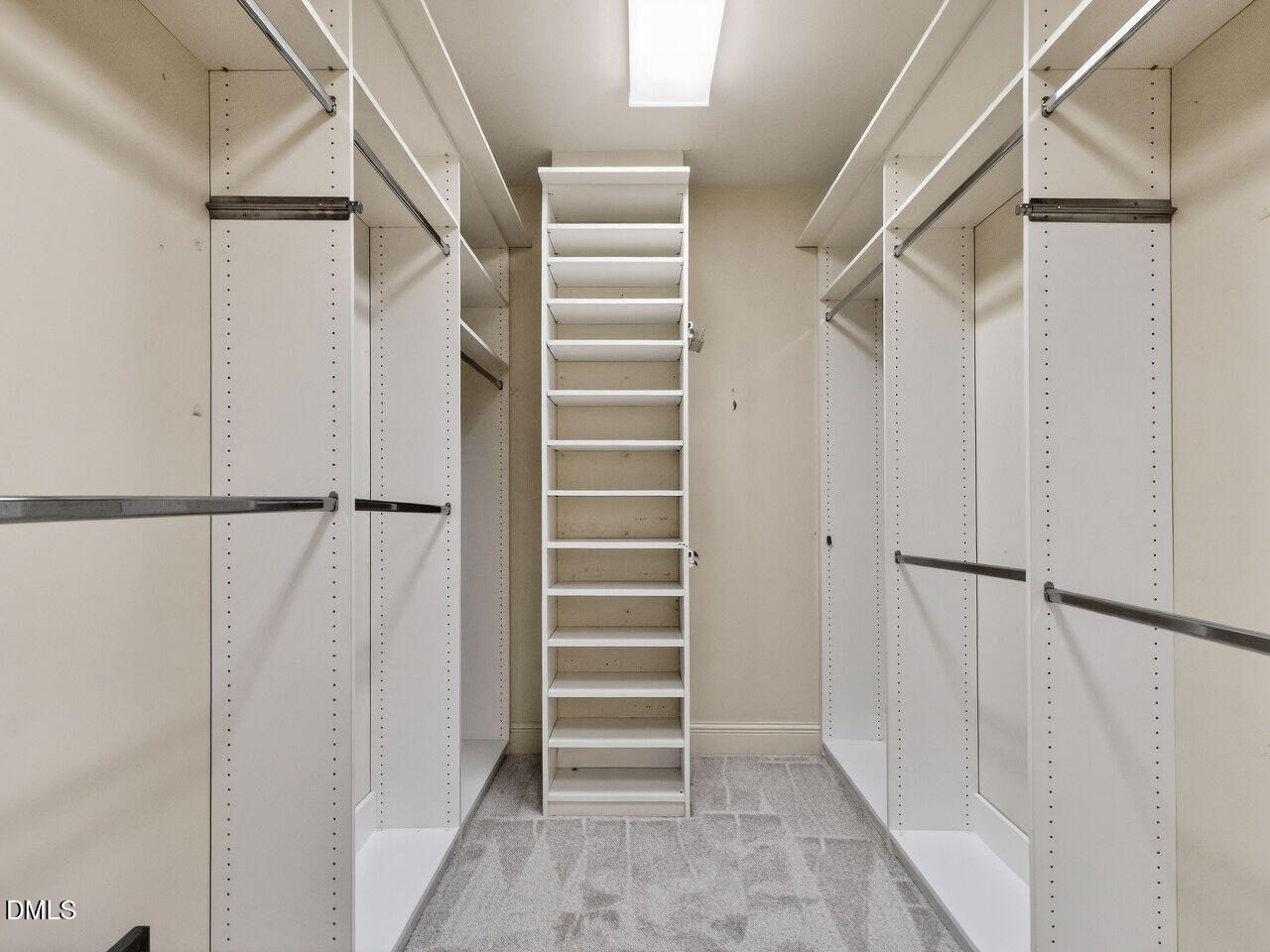 2901 Market Bridge Lane, Unit 104 Raleigh, NC 27608 - Photo 34 of 45 a view of walk in closet with empty racks