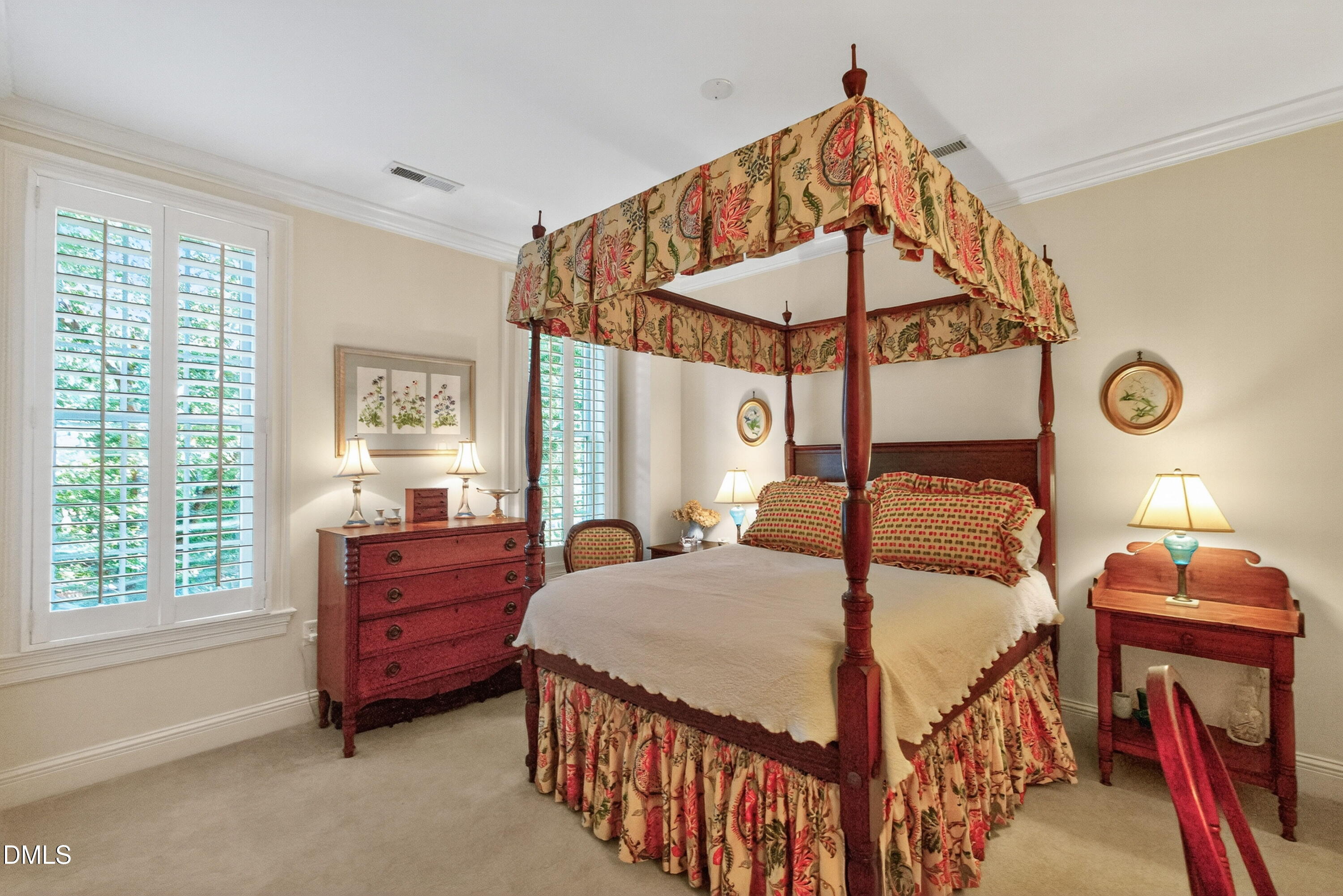 2901 Market Bridge Lane, Unit 104 Raleigh, NC 27608 - Photo 35 of 45 a bedroom with a bed and a chandelier