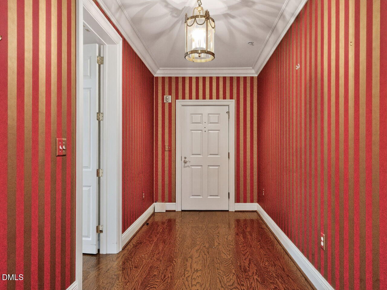 2901 Market Bridge Lane, Unit 104 Raleigh, NC 27608 - Photo 5 of 45 a view of an entryway with a chandelier