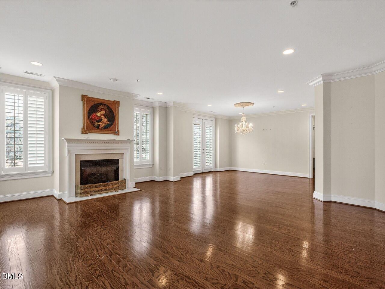 2901 Market Bridge Lane, Unit 104 Raleigh, NC 27608 - Photo 9 of 45 a view of an empty room with wooden floor fireplace and a window