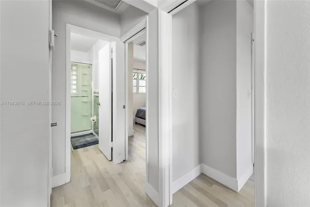 a view of a bathroom from a hallway