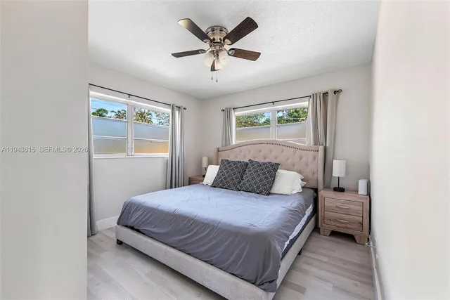 a bedroom with a bed and window