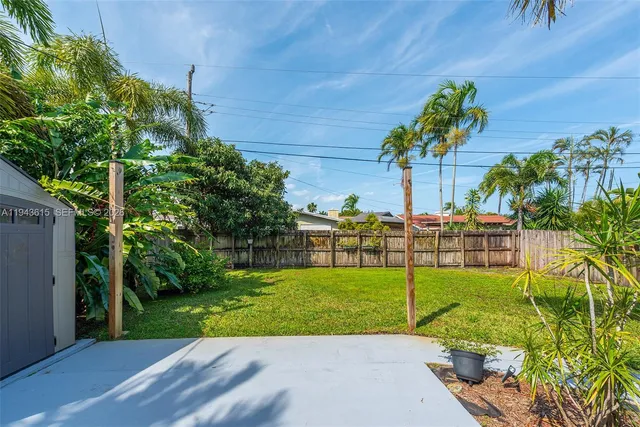 a view of a garden with a building in the background