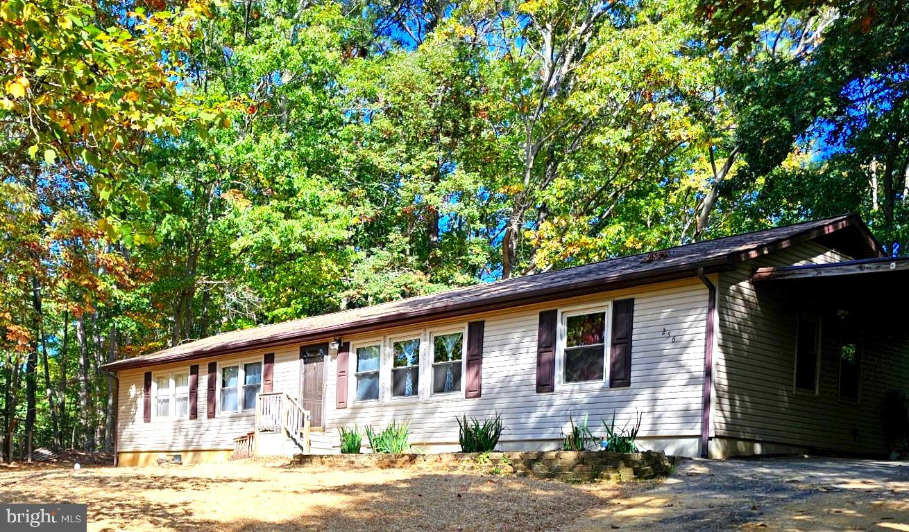 256 Frontier Trail Lusby, MD 20657 - Photo 2 of 28 Yard newly graded and seeded after septic install!