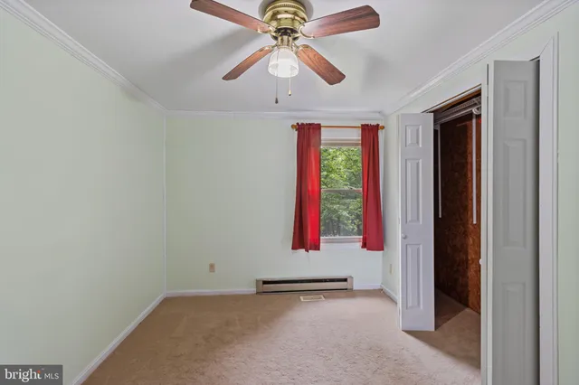 a view of a hallway with closet area